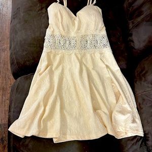 Off white spaghetti strap dress underneath the breast part is see-through lace